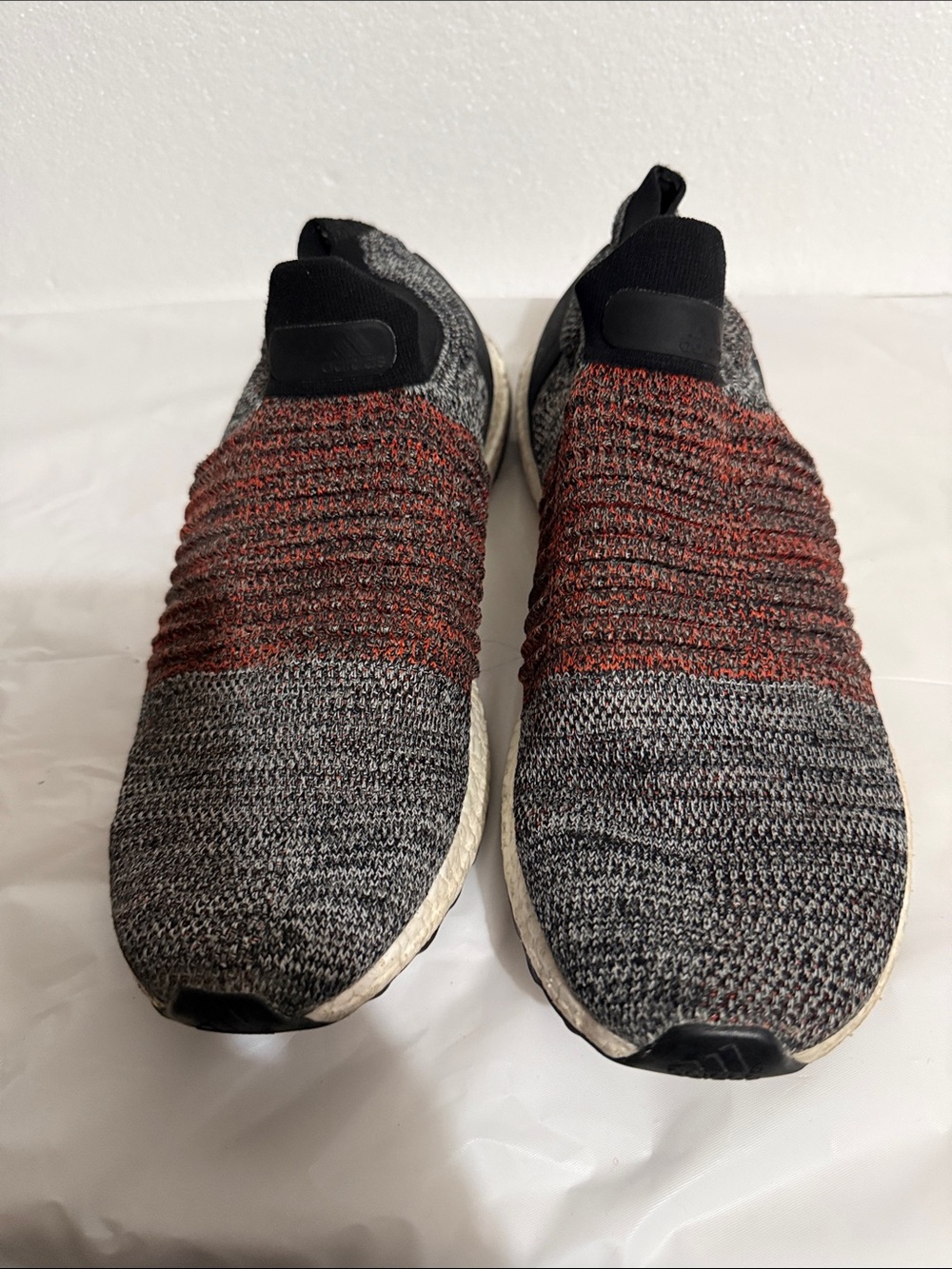 Adidas Ultra Boost Men's Slip-On Knit Sneakers in black and Red Accent